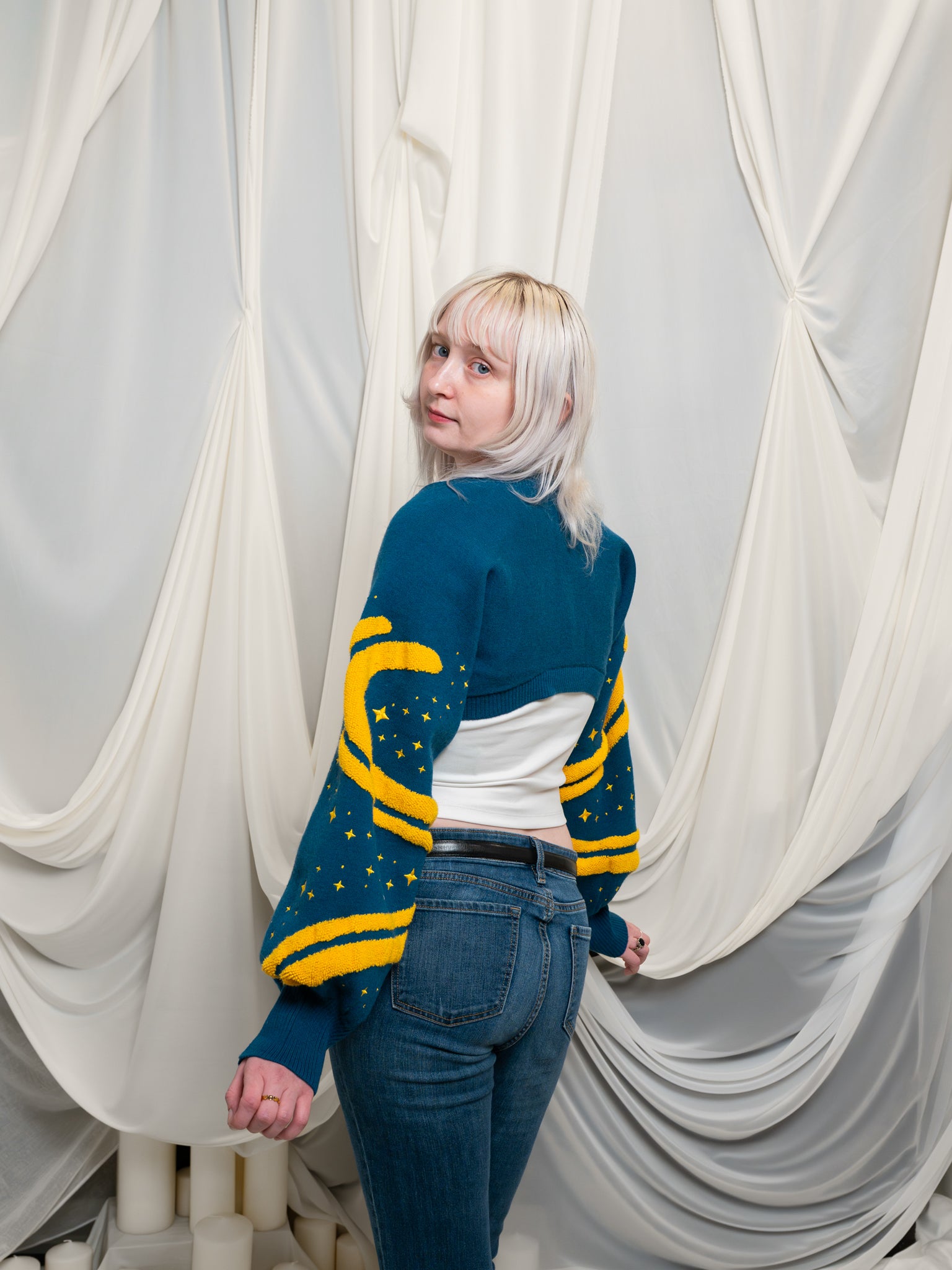 Over the shoulder view of blue and yellow blue moon bolero in size extra small.