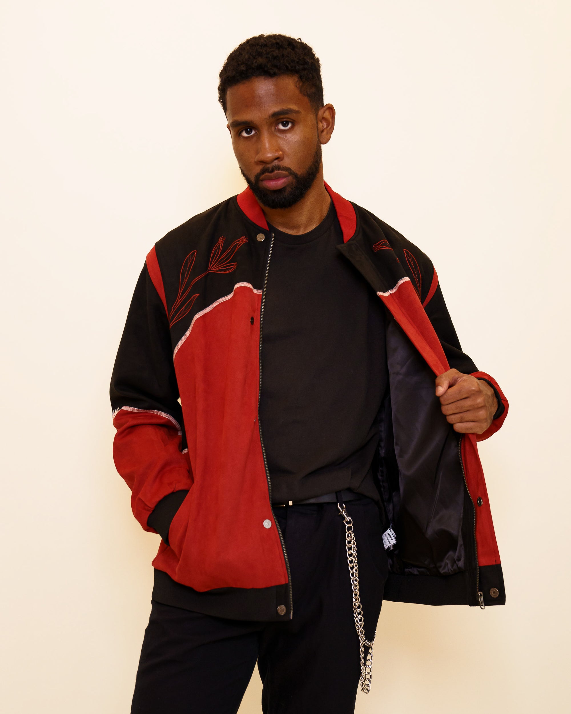 Man wearing calling card faux-suede jacket in size large showing lined interior. 