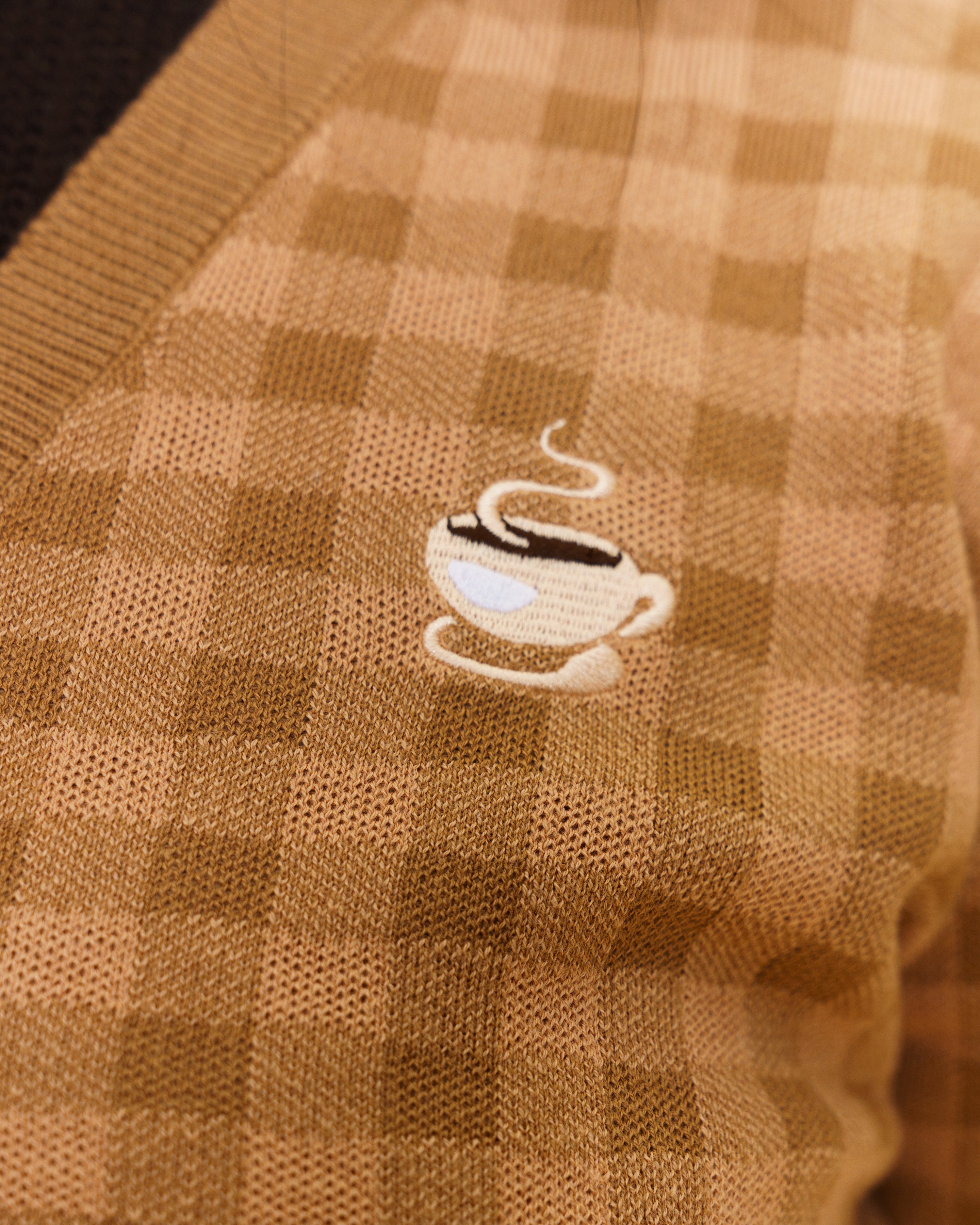 Close up of cappuccino mini cardigan embroidered coffee detail.