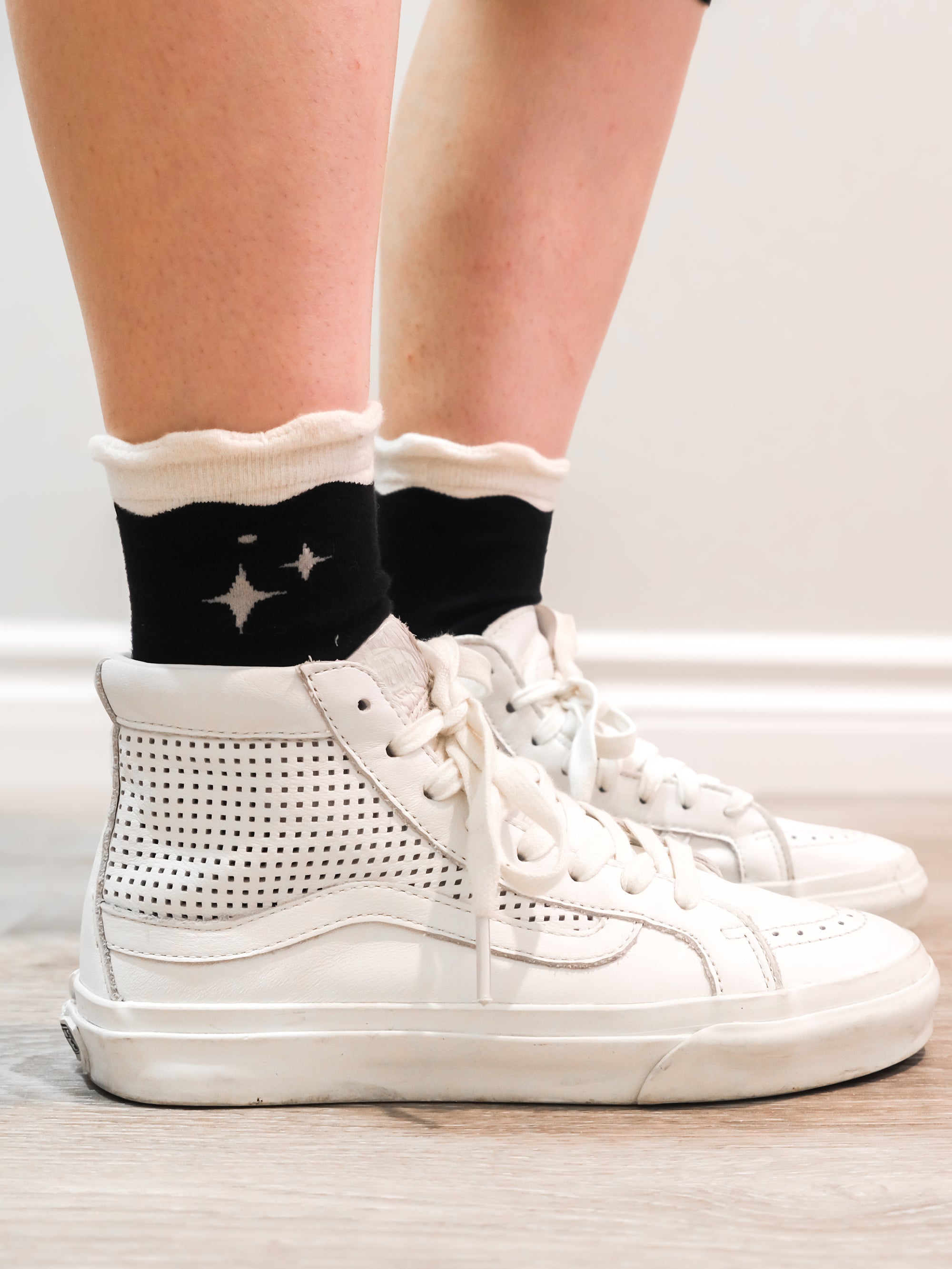 Deep space socks worn with white sneakers.