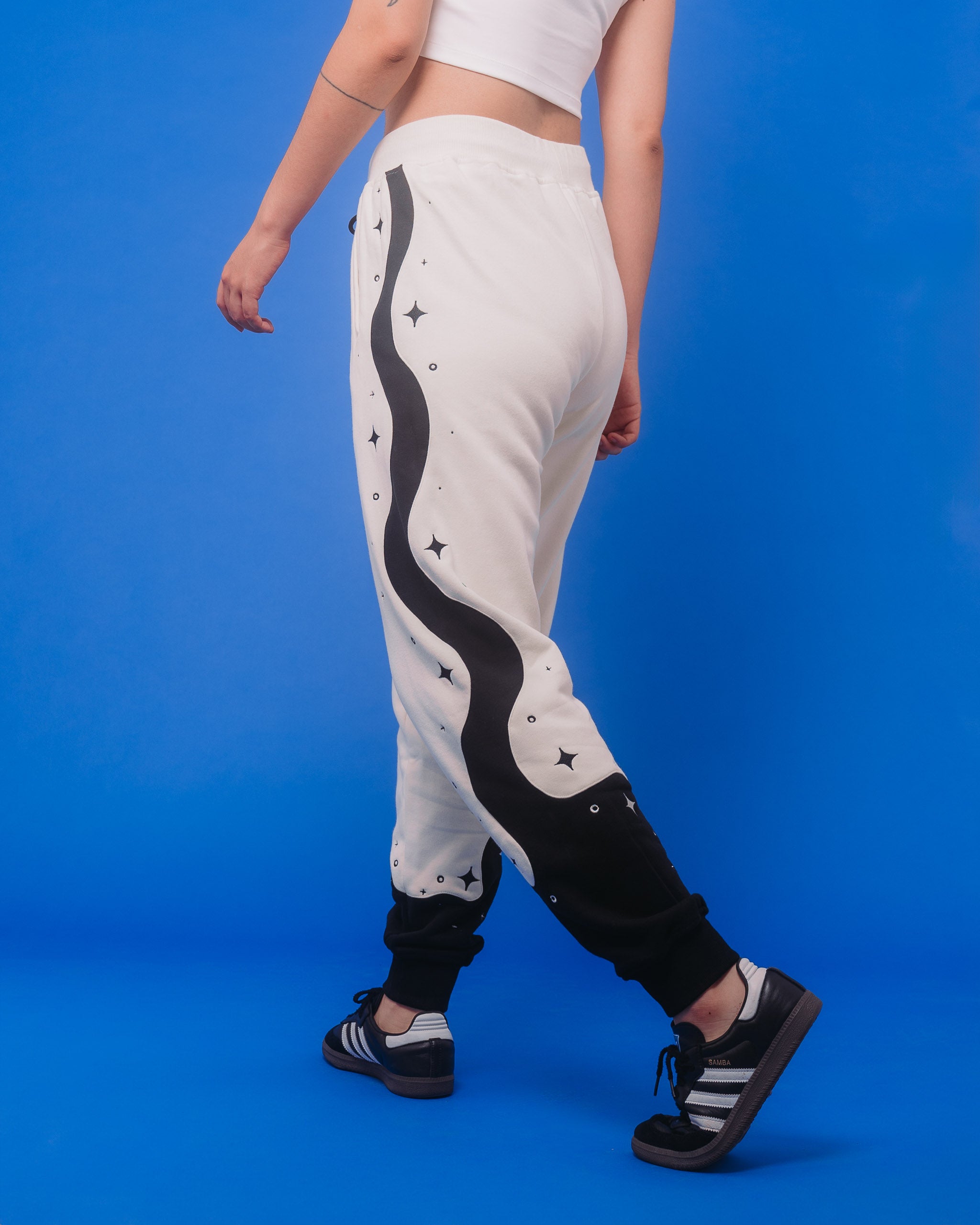 Back view of supernova joggers showing wavy black design with sparkles going down the side.