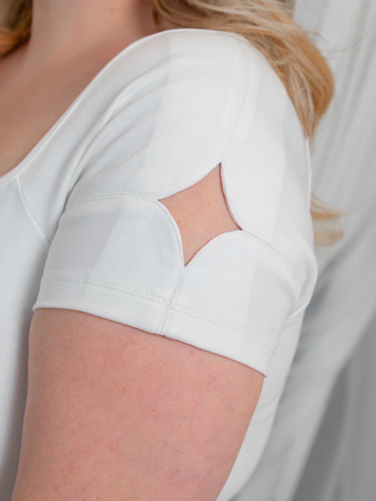Close up of supernova (white) cap sleeve tee sparkle cut.